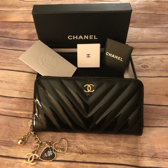 CHANEL Handbags - chanel black patent leather long wallet w/ charm